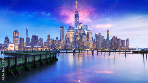 amazing view lower Manhattan   New York City - financial district after sunset from New Jersey