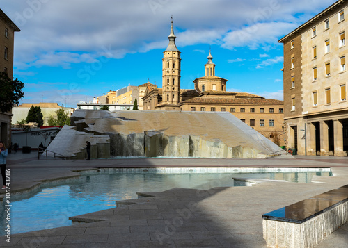 Zaragoza, Spain/Europe; 12/1/2019: Fountain of the Hispanicity in Pillar Square (Plaza del Pilar) and the church of San Juan de los Panetes