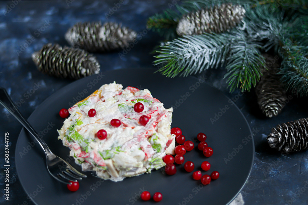Salad of crackers, Peking cabbage, sweet pepper, hard cheese, balyk. Dressed with mayonnaise sauce. Garnished with cranberries. Festive, New Year's dish. High-calorie, nutritious. Copy space. 