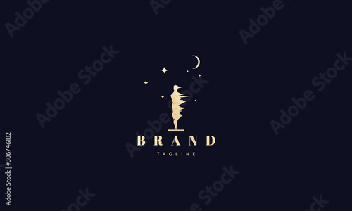 Vector golden logo on which an abstract image of a man under a strong wind against the background of the moon and stars.
