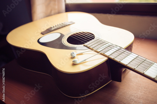 A guitar , close up,Vintage style photo with custom white balance, color filters, soft focus effect, and some fine film grain added