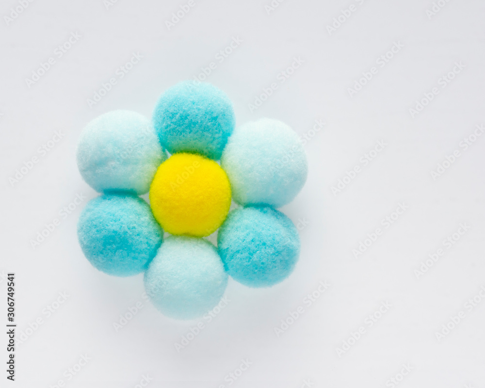 Delicate fluffy round pompons form a camomile Delicate fluffy round pompons form a camomile