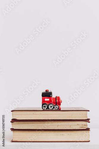 Christmas toy red retro locomotive books isolated