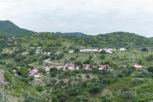 Neighborhood between green nature in a cloudy and cold day