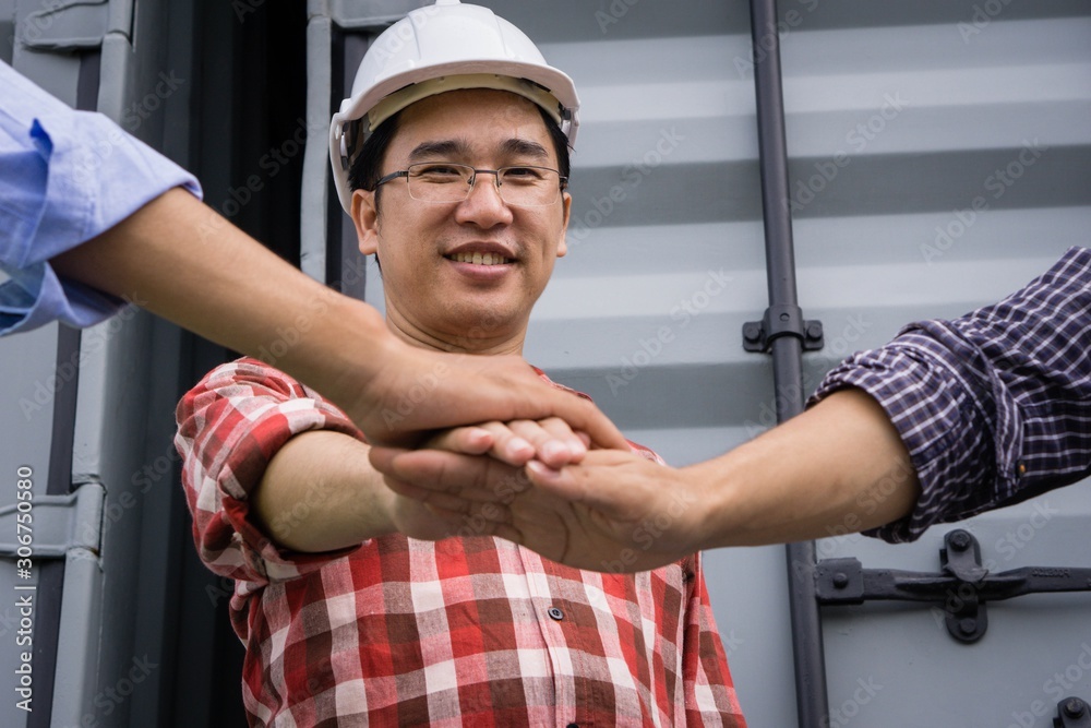 Asian Engineer with co-worker Join Hands Together. Business, Unity Concept. Asian Engineer with co-worker Join Hands Together. Business, Unity Concept.