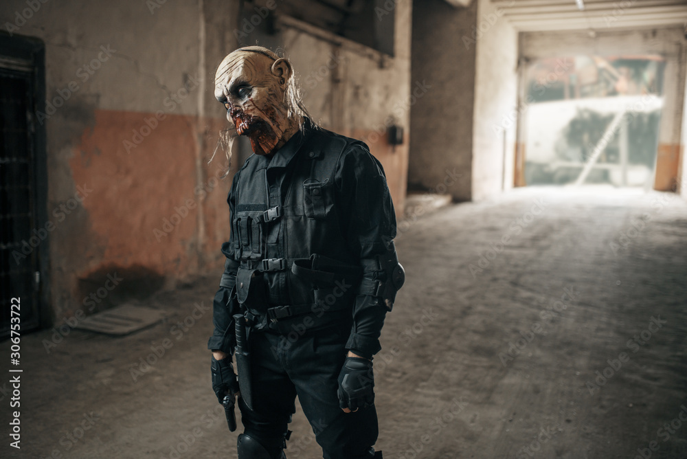 Fototapeta premium Male zombie walking in abandoned factory