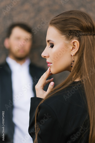 Stylish photo of a couple in love. Valentine's day. Portrait of a girl on the background of her man