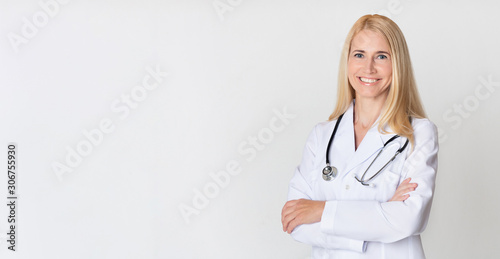 Healthcare concept. Middle-aged woman doctor in uniform photo