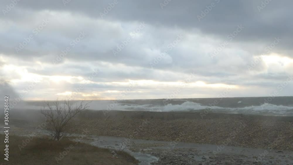 Large Sea waves Crashing against shore during heavy storm Large Sea waves Crashing against shore during heavy storm