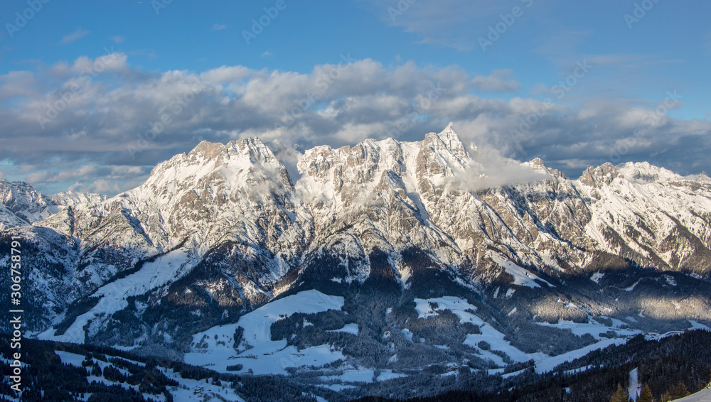 Mountain portrait Birnhorn Saalbach dramatic clouds perfect blue sky light scenic mood