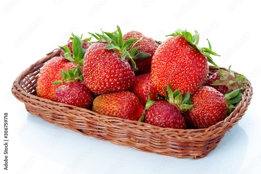 Strawberries in a basket isolated on white background Strawberries in a basket isolated on white background