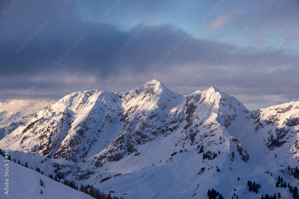 Obraz premium Mountain portrait Birnhorn Saalbach dramatic clouds perfect blue sky light scenic mood