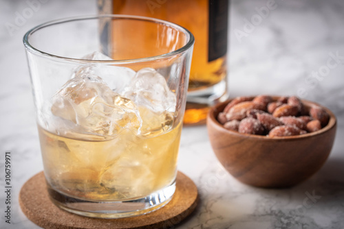 whiskey on the rocks with salted almond