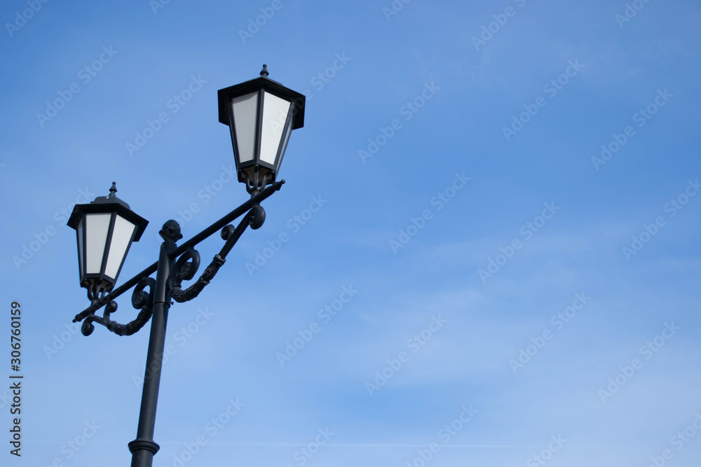 street lamp and clear blue sky.