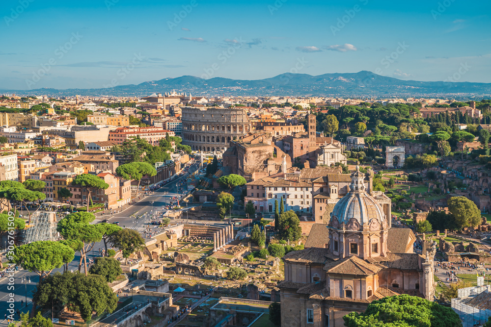 Aerial panorama of historic center of Rome, Italy with Colosseum and Roman Forum.