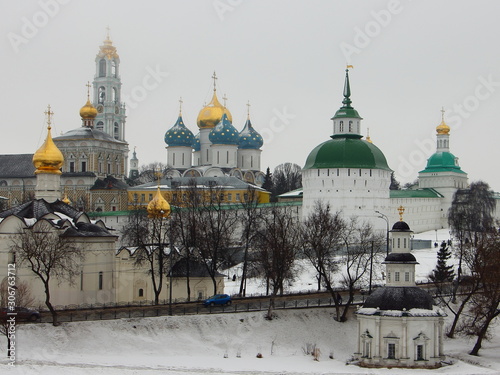 Sergiev Posad, Moscow Region, Russia Golden Ring, Troitse Sergieva lavra church with domes, landmark on snowy winter day, view from observation deck on gray sky background photo