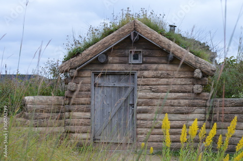 Sod house on the prairie during summer