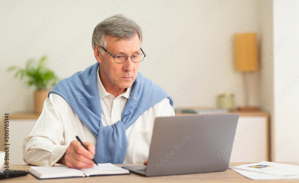 Elderly Man Using Laptop Working In Modern Office Elderly Man Using Laptop Working In Modern Office