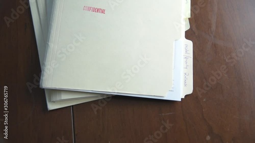 Confidential Folders Slapped Onto Table 60fps