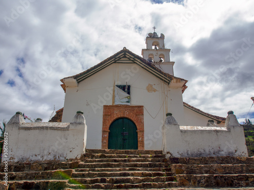 Deteriorated facade of the church of Chiquiza, a town and municipality in the Central Boyacá Province, part of the Colombian Department of Boyacá in the central Andean mountains. photo