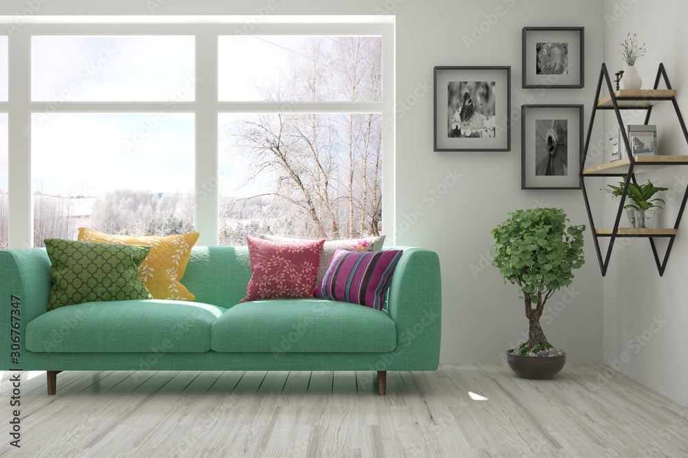 Fototapeta premium Stylish room in white color with sofa and winter landscape in window. Scandinavian interior design. 3D illustration