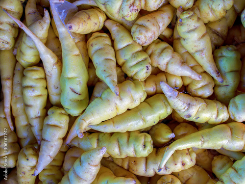 Close-up photography of a bunch of mashua tubers, captured at the traditional local market of the colonial town of Villa de Leyva, in the Central Boyacá Province, part of the Colombian Department of B photo
