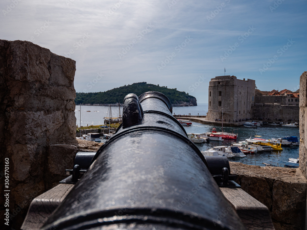 Old Cannon pointed out over Dubrovnik Old Port, Croatia
