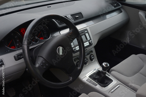 Car Interior. Steering wheel and dashboard in a car interior. Shiny and Black © vladico