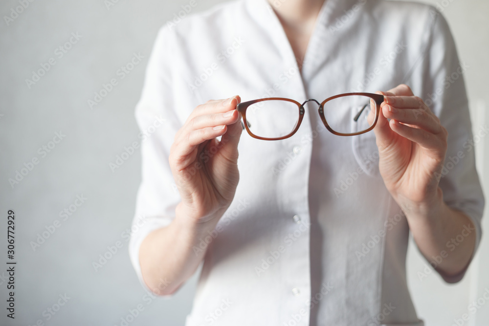 Ophthalmologist make you try new glasses. Hyperopia or myopia concept Ophthalmologist make you try new glasses. Hyperopia or myopia concept