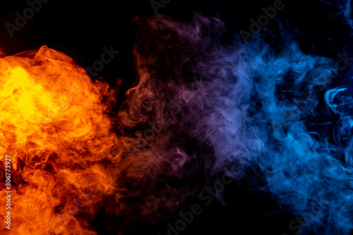 Orange purple and blue smoke on black background