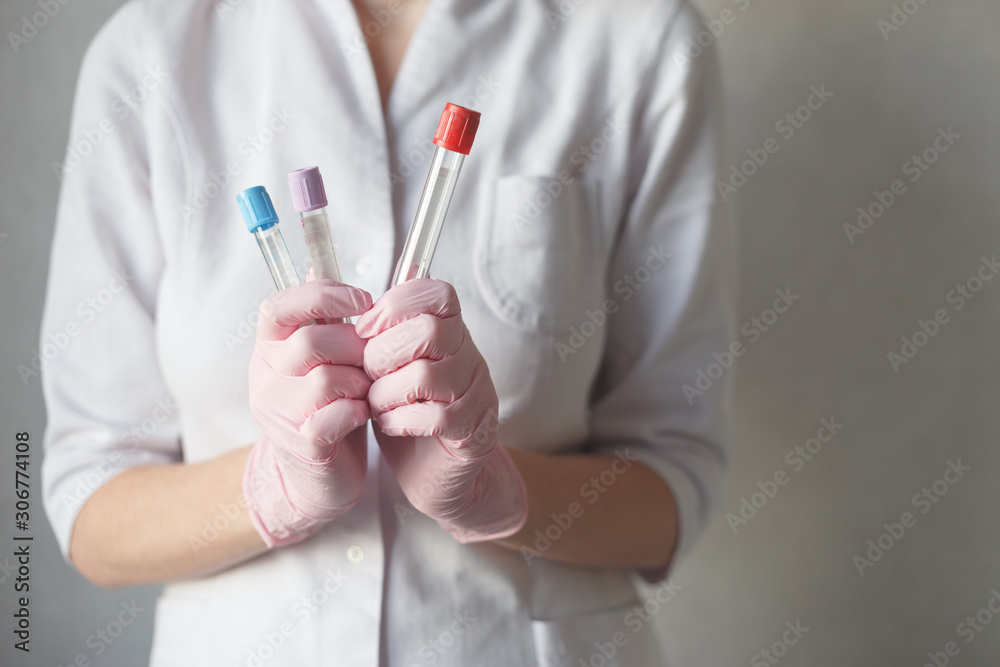 Nurse holds tubes for blood test. Close-up view Nurse holds tubes for blood test. Close-up view