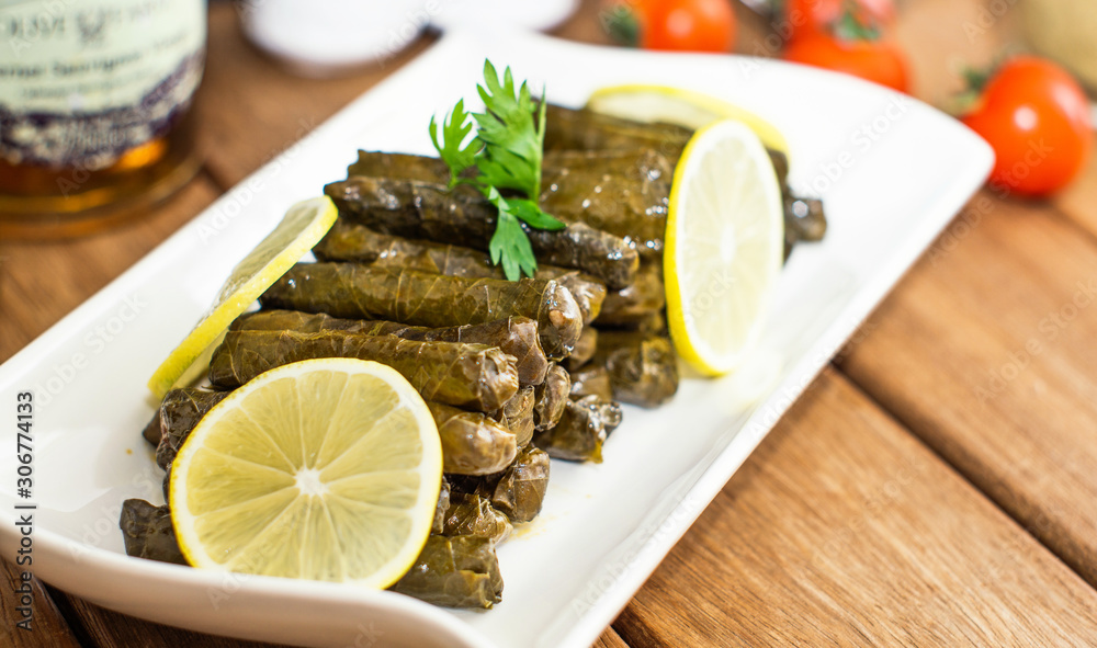 turkish stuffed grape leaves in white plate turkish stuffed grape leaves in white plate