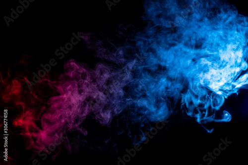 whispy deep durple and electric blue smoke on black background with room for text