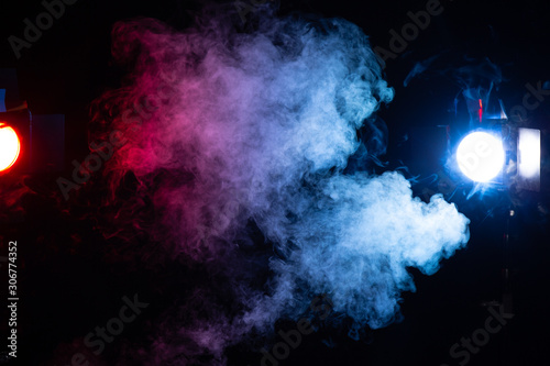 Fototapeta Naklejka Na Ścianę i Meble -  red blue and white smoke cloud with stage lights on black background