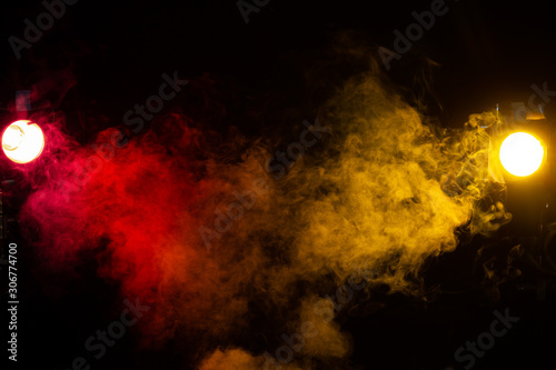 red and yellow stage lights with smoke 