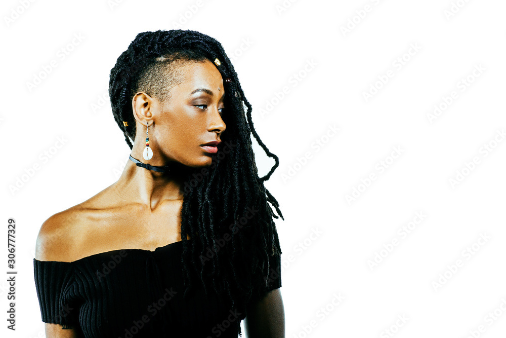 Profile portrait of an African American woman with dreadlocks looking ...