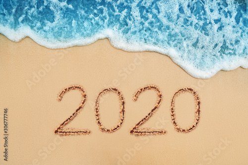 Happy New Year 2020 concept on the sea beach; sunrsie shot photo