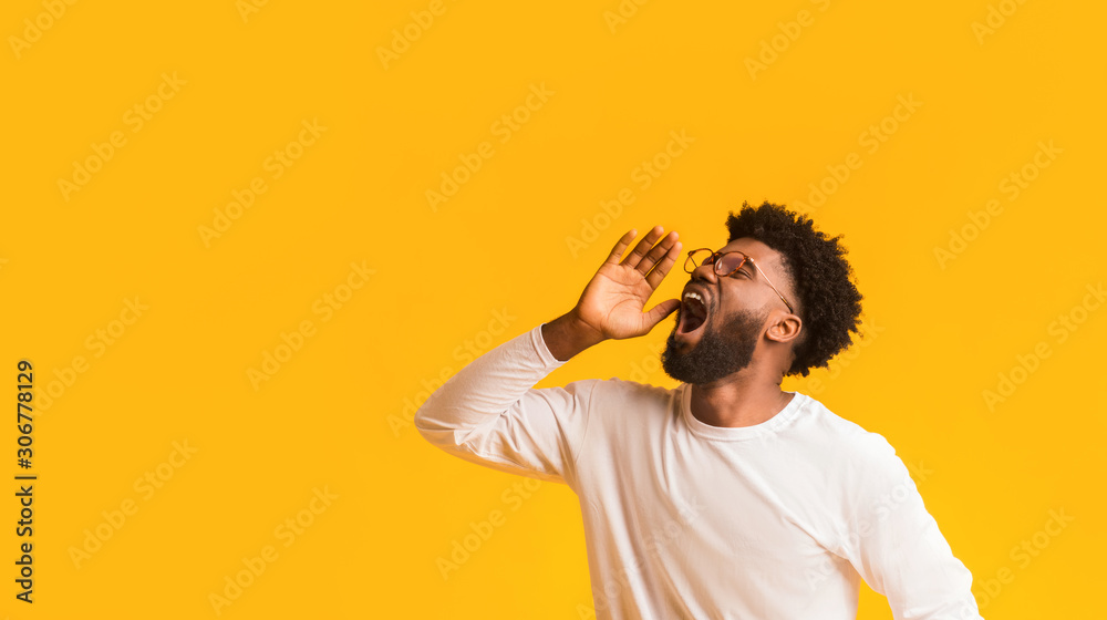 Fototapeta premium African american man in glasses screaming with excitement