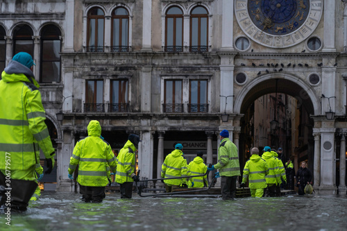 VENICE, ITALY - November 24, 2019: St. Marks Square (Piazza San Marco) during flood (acqua alta) in Venice, Italy. Venice high water. Natural disaster