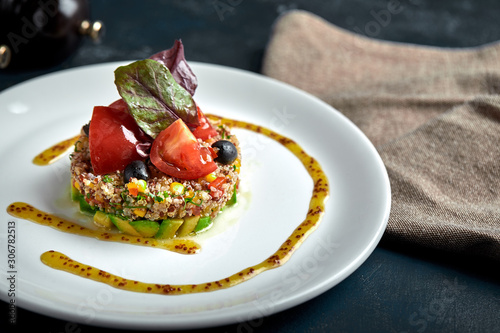 Delicious quinoa salad with avocado and tomatoes. Macro.