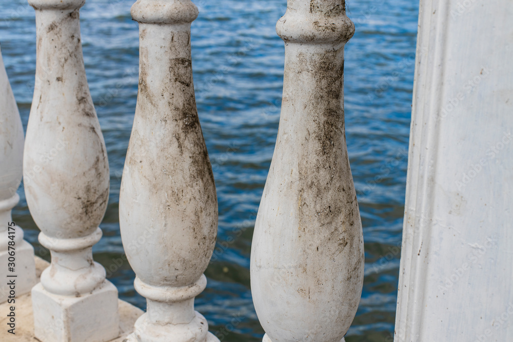Fototapeta premium dirty marble column fence architecture element background desolate mood picture 