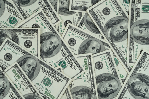 Pile of US dollar bills as background. Top view point