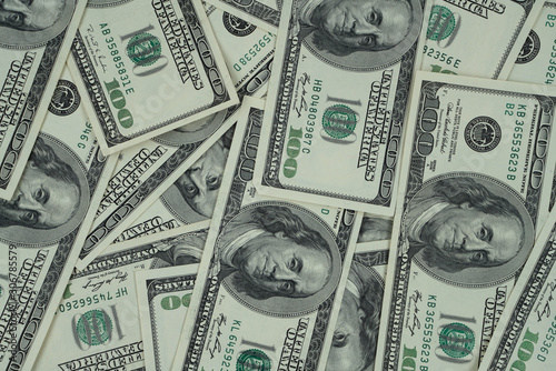 Pile of US dollar bills as background. Top view point