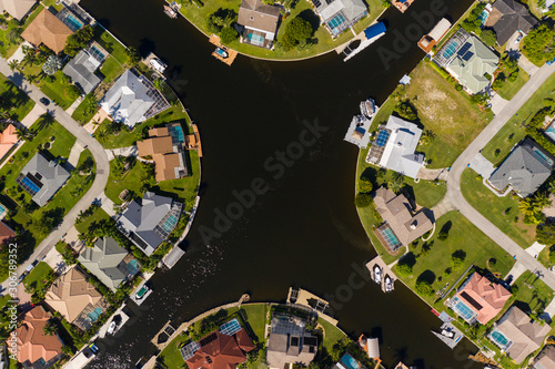 Aerial photos of Cape Coral residence houses and canals with Fort Myers in the background