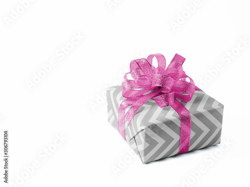 Surprise gift with a pink bow on white background. Isolate.
