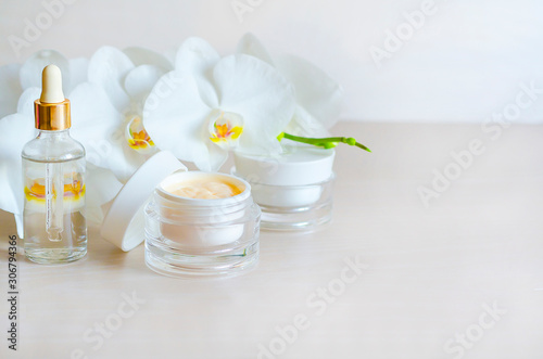 beauty concept. natural cosmetic product for skin care. spa treatments for face  body in the salon. cream  serum for nutrition  moisturizing the skin with white orchid extract  home care. copy space