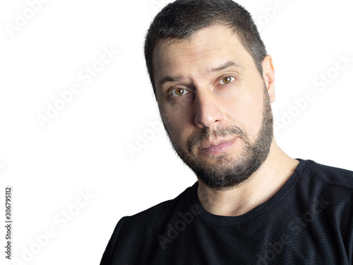 Pretty man with a beard in a dark sweater on a white background