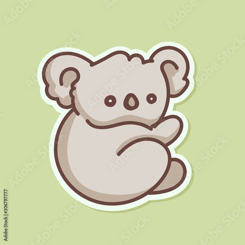 Cute baby koala bear sticker isolated on green background photo