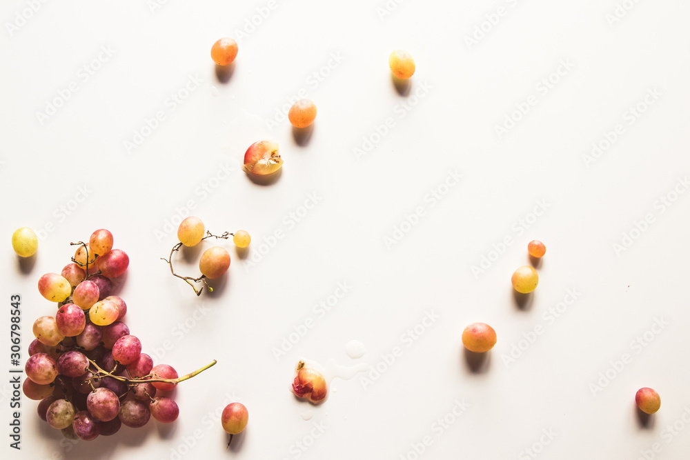 Ripe red grape with leaves isolated on white Ripe red grape with leaves isolated on white