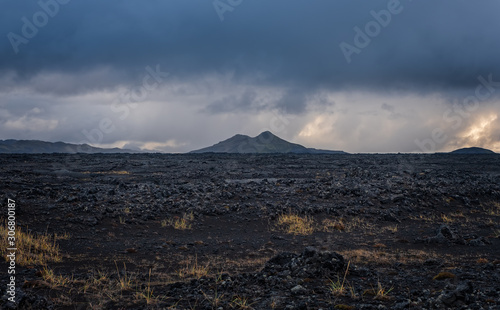 Iceland in september 2019. Great Valley Park Landmannalaugar, surrounded by mountains of rhyolite and unmelted snow. In the valley built large camp. Evening in september 2019 photo